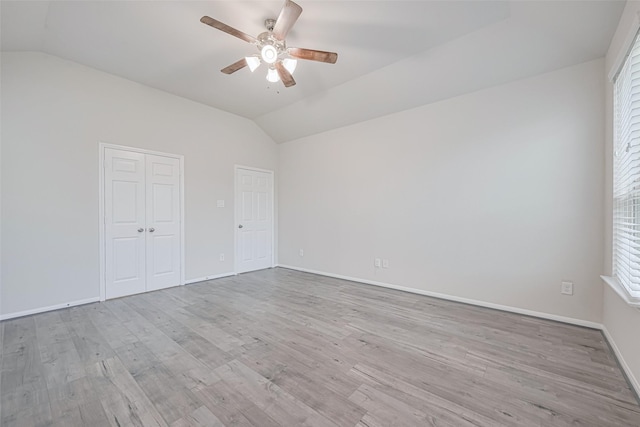 23607 Acerola Tree Ct, Katy, TX 77493 - spare room with vaulted ceiling, a ceiling fan, and wood finished floors