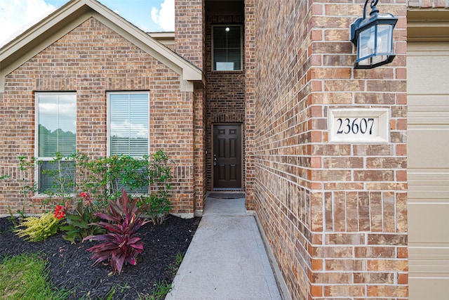 23607 Acerola Tree Ct, Katy, TX 77493 - view of exterior entry featuring brick siding
