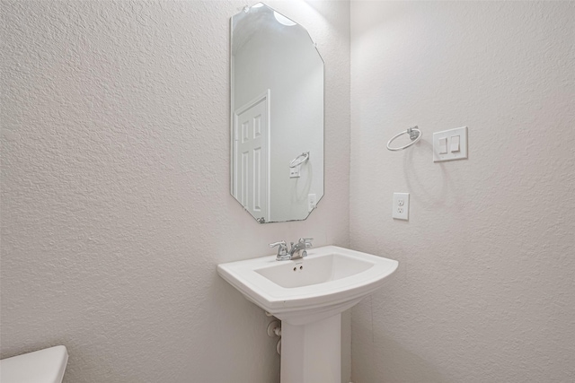 23607 Acerola Tree Ct, Katy, TX 77493 - half bath with toilet and a textured wall