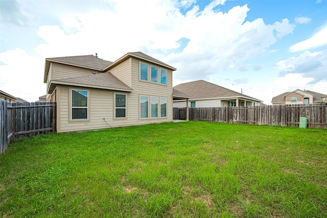 23607 Acerola Tree Ct, Katy, TX 77493 - rear view of house with a shingled roof and a fenced backyard