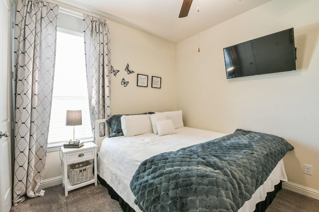 14011 Lago Creek Ct, Rosharon, TX 77583 - bedroom with dark carpet and a ceiling fan