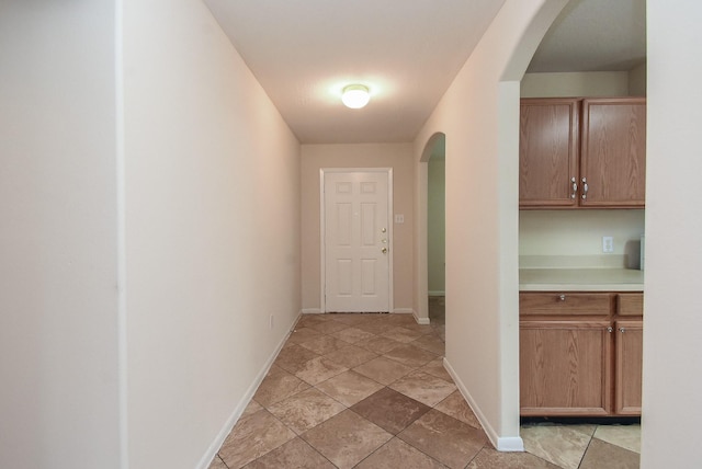 19727 Hon Ct, Katy, TX 77449 - hallway featuring arched walkways and baseboards