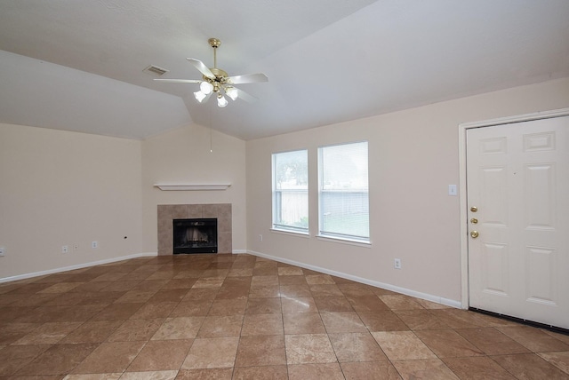 19727 Hon Ct, Katy, TX 77449 - unfurnished living room featuring a ceiling fan, vaulted ceiling, and a tiled fireplace