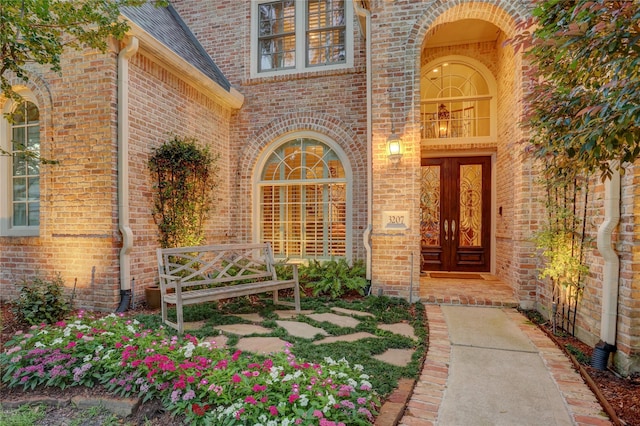 3207 Riviera Dr, Sugar Land, TX 77479 - doorway to property featuring brick siding and roof with shingles