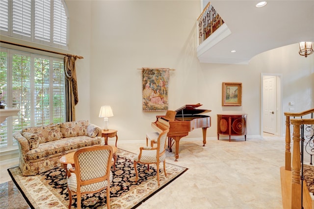 3207 Riviera Dr, Sugar Land, TX 77479 - living area with a high ceiling, plenty of natural light, a chandelier, and recessed lighting
