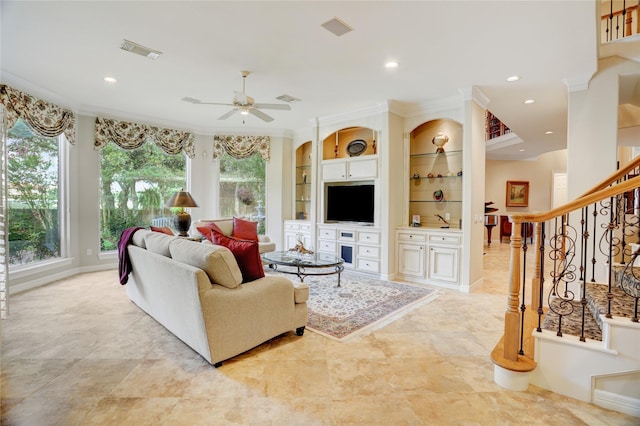 3207 Riviera Dr, Sugar Land, TX 77479 - living room featuring ceiling fan, recessed lighting, ornamental molding, stairs, and built in shelves