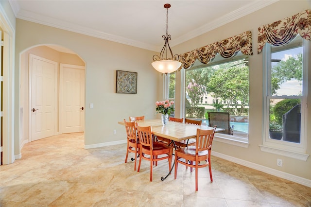 3207 Riviera Dr, Sugar Land, TX 77479 - dining room featuring ornamental molding, arched walkways, and plenty of natural light