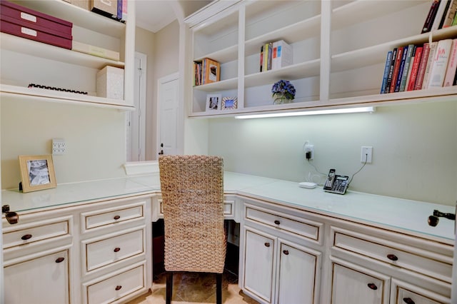 3207 Riviera Dr, Sugar Land, TX 77479 - office featuring built in desk, ornamental molding, and light tile patterned floors