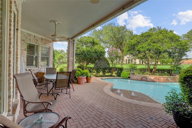 3207 Riviera Dr, Sugar Land, TX 77479 - swimming pool with a ceiling fan, a patio, and outdoor dining area