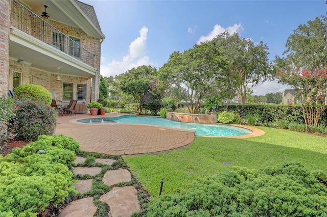 3207 Riviera Dr, Sugar Land, TX 77479 - view of swimming pool featuring a lawn and a patio area