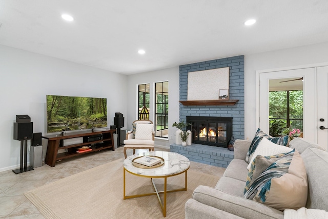 291 E Rainbow Ridge Cir, The Woodlands, TX 77381 - living area featuring healthy amount of natural light, recessed lighting, and a brick fireplace