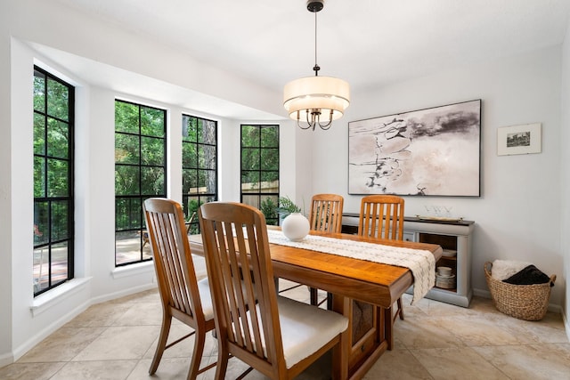 291 E Rainbow Ridge Cir, The Woodlands, TX 77381 - dining area with a chandelier and baseboards