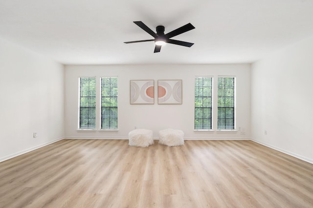 291 E Rainbow Ridge Cir, The Woodlands, TX 77381 - unfurnished room with wood finished floors, healthy amount of natural light, and a ceiling fan