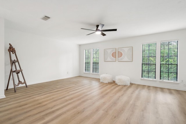291 E Rainbow Ridge Cir, The Woodlands, TX 77381 - empty room featuring a ceiling fan and light wood finished floors
