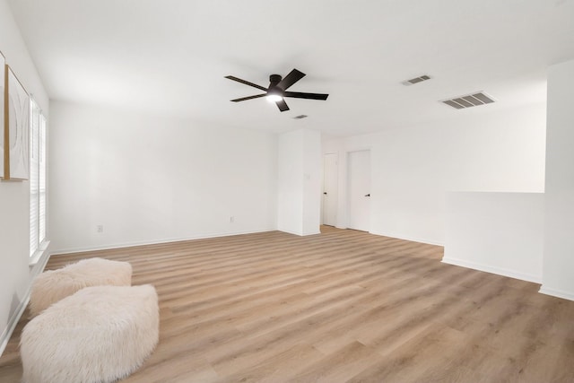 291 E Rainbow Ridge Cir, The Woodlands, TX 77381 - spare room featuring a ceiling fan and light wood-type flooring