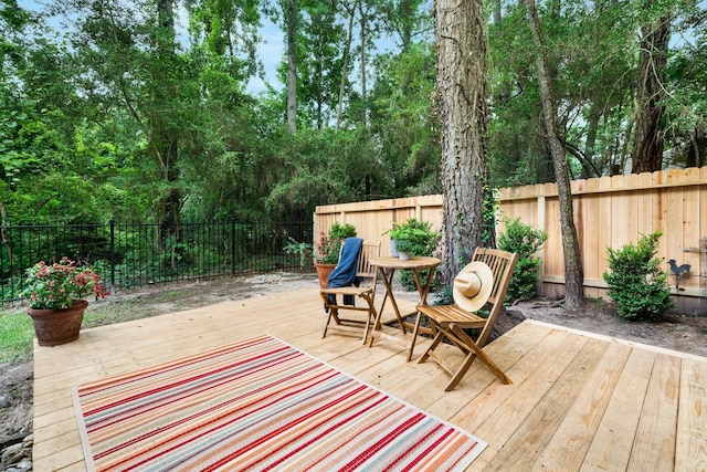 291 E Rainbow Ridge Cir, The Woodlands, TX 77381 - deck featuring a fenced backyard