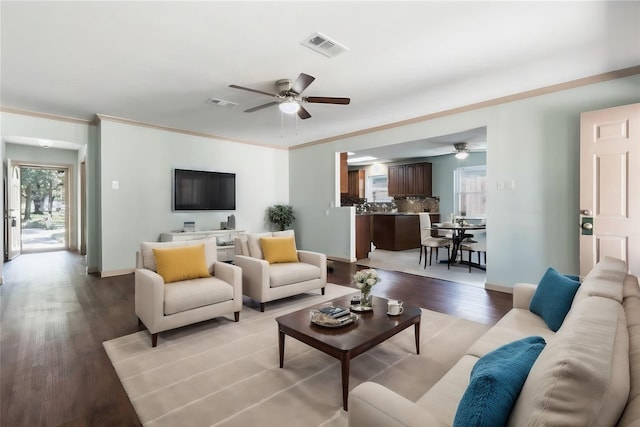 5402 Sheraton Oaks Dr, Houston, TX 77091 - living area with ceiling fan, light wood-type flooring, and ornamental molding