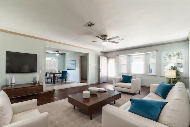 5402 Sheraton Oaks Dr, Houston, TX 77091 - living area with ceiling fan, light wood-style floors, and ornamental molding