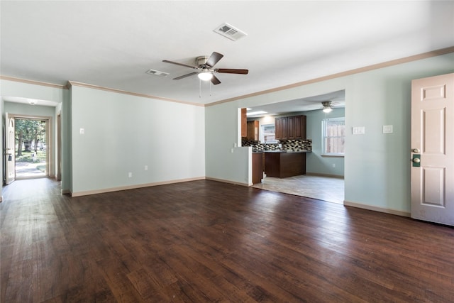 5402 Sheraton Oaks Dr, Houston, TX 77091 - unfurnished living room with a ceiling fan, dark wood-type flooring, and crown molding