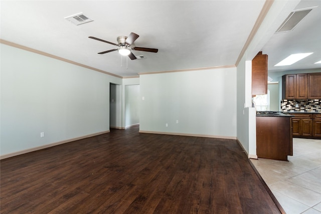 5402 Sheraton Oaks Dr, Houston, TX 77091 - unfurnished living room with ornamental molding, ceiling fan, and light wood finished floors