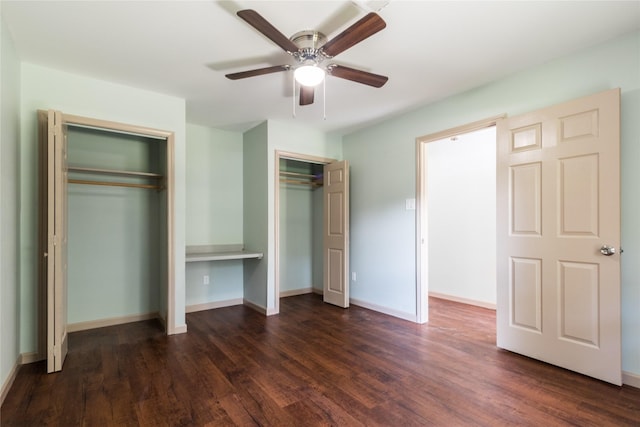 5402 Sheraton Oaks Dr, Houston, TX 77091 - unfurnished bedroom featuring two closets, dark wood-style flooring, and a ceiling fan