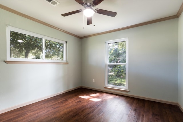 5402 Sheraton Oaks Dr, Houston, TX 77091 - unfurnished room with healthy amount of natural light, dark wood-type flooring, crown molding, and ceiling fan