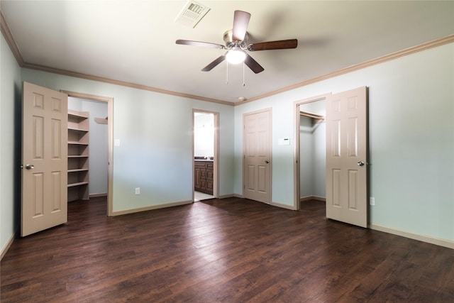 5402 Sheraton Oaks Dr, Houston, TX 77091 - unfurnished bedroom with a spacious closet, a closet, dark wood-style flooring, crown molding, and ceiling fan