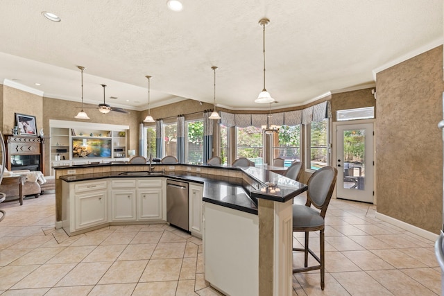 3602 Vashon Ln, Spring, TX 77388 - kitchen featuring stainless steel dishwasher, open floor plan, dark countertops, light tile patterned flooring, and recessed lighting