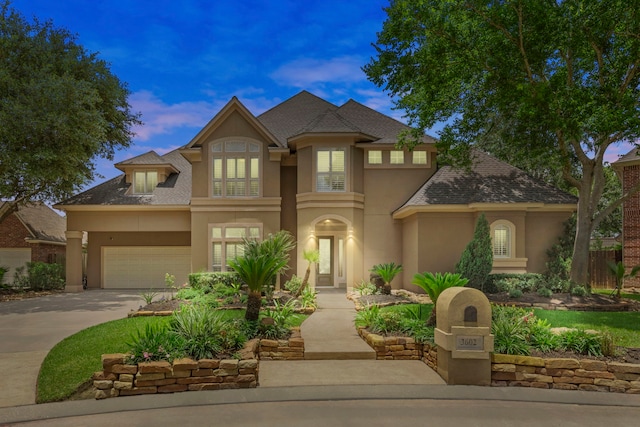 3602 Vashon Ln, Spring, TX 77388 - french country style house with stucco siding, driveway, and a shingled roof