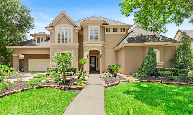 3602 Vashon Ln, Spring, TX 77388 - view of front of home with stucco siding, an attached garage, a front yard, and concrete driveway