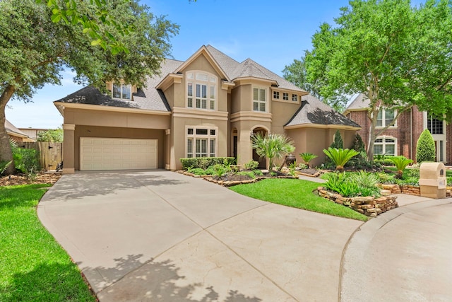 3602 Vashon Ln, Spring, TX 77388 - view of front of property featuring stucco siding, concrete driveway, a garage, and a shingled roof
