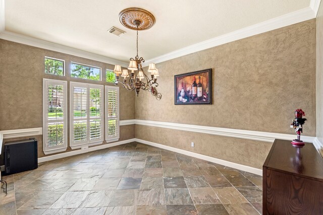 3602 Vashon Ln, Spring, TX 77388 - unfurnished dining area with stone tile flooring, a chandelier, and ornamental molding