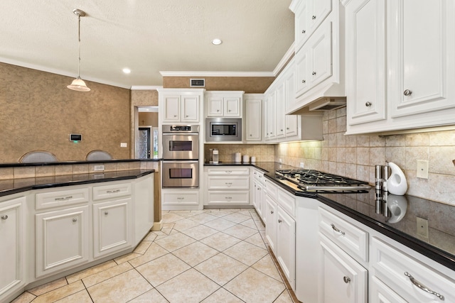3602 Vashon Ln, Spring, TX 77388 - kitchen with stainless steel appliances, dark countertops, crown molding, light tile patterned flooring, and white cabinetry