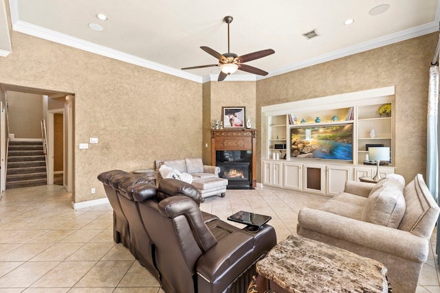 3602 Vashon Ln, Spring, TX 77388 - living area featuring a ceiling fan, light tile patterned floors, stairway, ornamental molding, and a fireplace