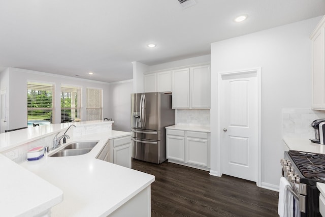 2018 Rd 660, Dayton, TX 77535 - kitchen featuring appliances with stainless steel finishes, backsplash, white cabinetry, a kitchen island with sink, and recessed lighting