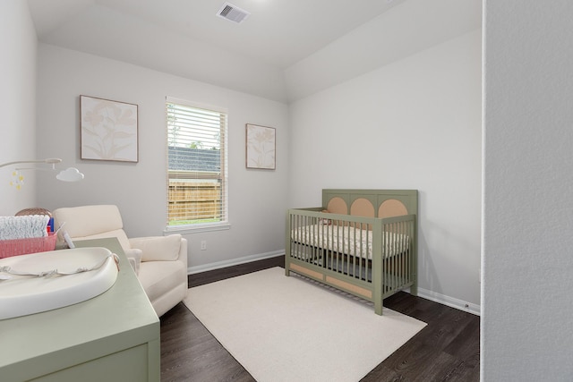 2018 Rd 660, Dayton, TX 77535 - bedroom featuring a nursery area, dark wood-type flooring, and lofted ceiling