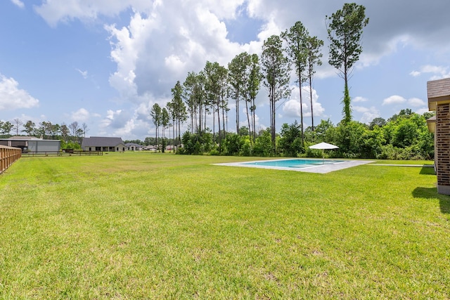 2018 Rd 660, Dayton, TX 77535 - view of grassy yard with an outdoor pool