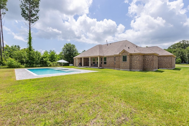 2018 Rd 660, Dayton, TX 77535 - outdoor pool featuring a patio and a lawn