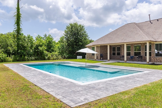 2018 Rd 660, Dayton, TX 77535 - outdoor pool with a patio and a lawn