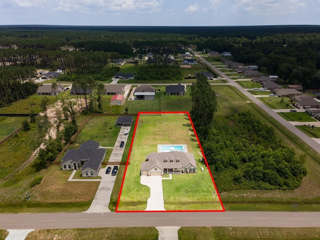 2018 Rd 660, Dayton, TX 77535 - aerial view of residential area featuring a heavily wooded area and property parcel outlined