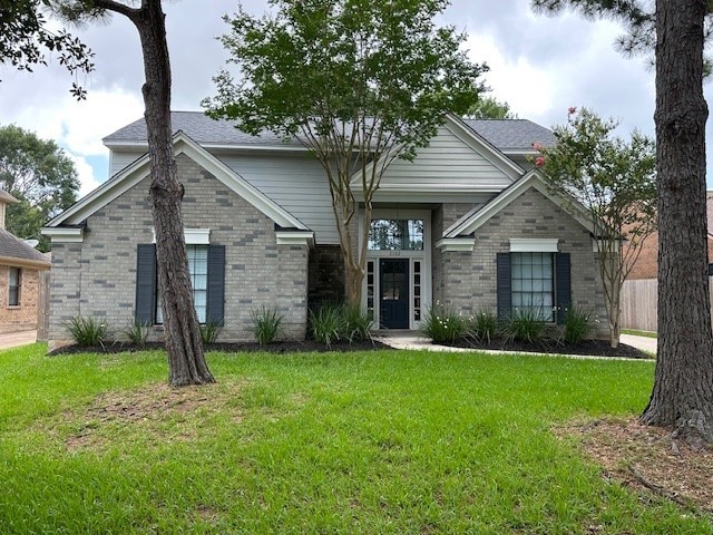 2102 Autumn Cove Dr, League City, TX 77573 - view of front of property with brick siding and a front yard