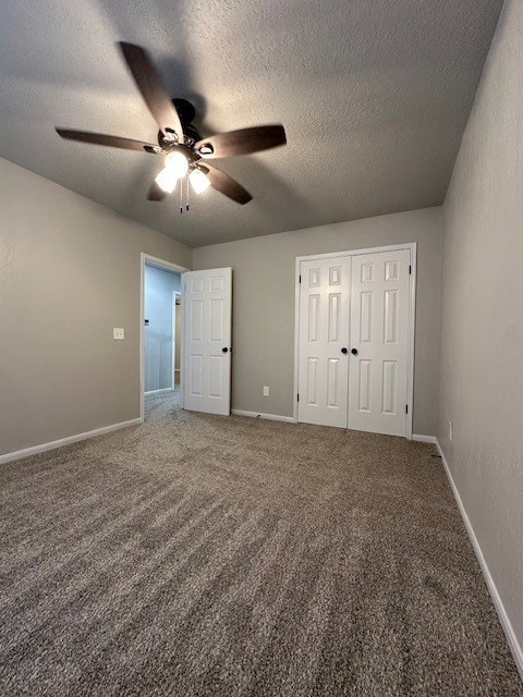 2102 Autumn Cove Dr, League City, TX 77573 - unfurnished bedroom featuring carpet floors, a textured ceiling, a closet, and a ceiling fan