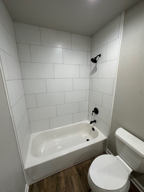 2102 Autumn Cove Dr, League City, TX 77573 - bathroom featuring wood finished floors and shower / washtub combination