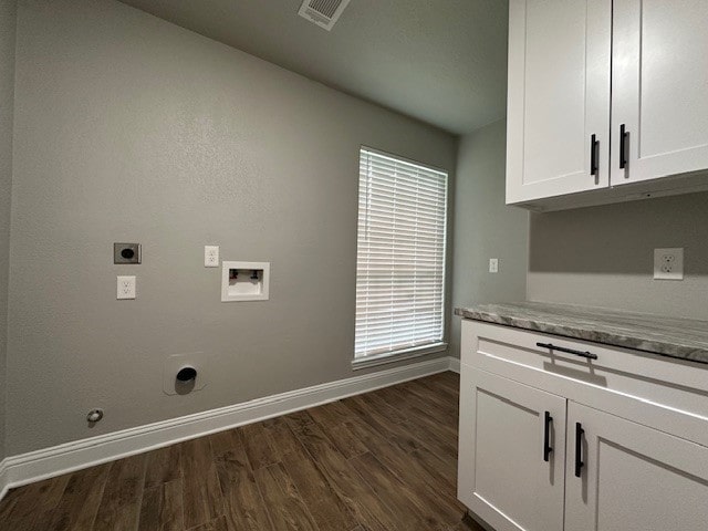 2102 Autumn Cove Dr, League City, TX 77573 - laundry area featuring electric dryer hookup, washer hookup, dark wood-style floors, cabinet space, and gas dryer hookup