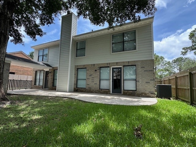 2102 Autumn Cove Dr, League City, TX 77573 - back of property featuring a patio area, a chimney, and brick siding