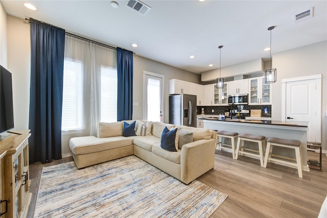 320 Parker Willow Ln, Houston, TX 77076 - living area with light wood-style flooring and recessed lighting