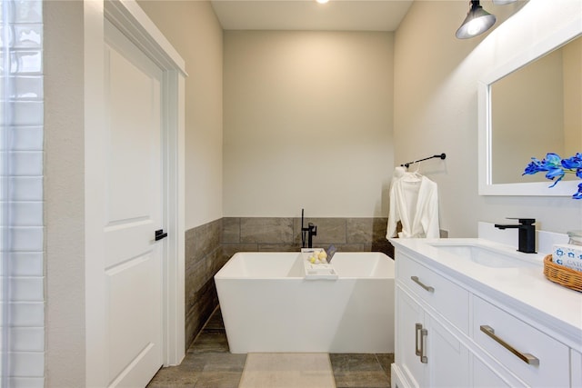 320 Parker Willow Ln, Houston, TX 77076 - bathroom featuring a freestanding bath, vanity, and recessed lighting