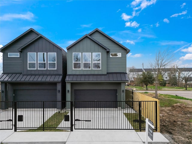 3004 Beulah St, Houston, TX 77004 - view of front of home with a garage, driveway, board and batten siding, a metal roof, and a standing seam roof
