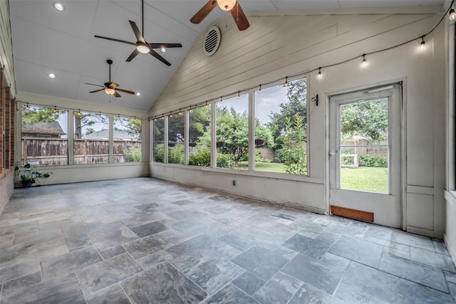 5531 Cherish Trl, Katy, TX 77494 - unfurnished sunroom with ceiling fan, stone tile flooring, high vaulted ceiling, and wooden walls
