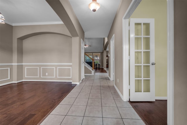 5531 Cherish Trl, Katy, TX 77494 - entrance foyer with stairs, arched walkways, wood finished floors, and ornamental molding